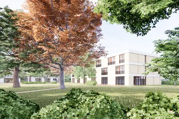 Moderne wooncomplex in Park Achterhoek met groene omgeving en bomen.